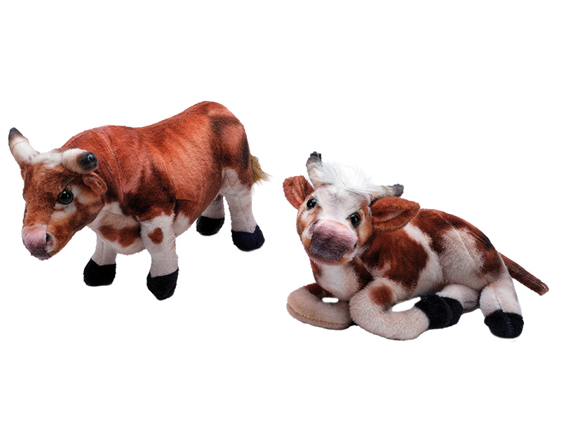 Kuh aus Plüsch stehend und liegend    Kuh aus Plüsch stehend und liegend