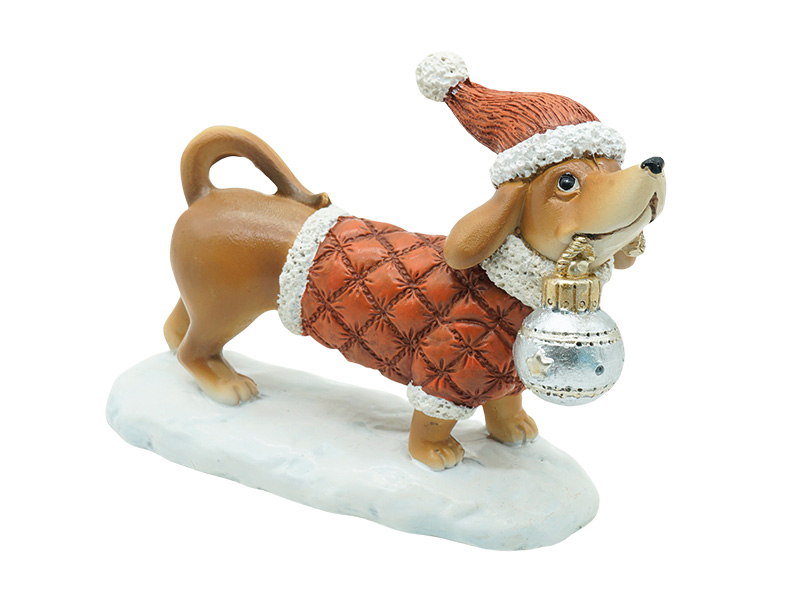 Dackel mit Weihnachtskugel aus Poly 12x5x9cm    Dackel mit Weihnachtskugel aus Poly 12x5x9cm